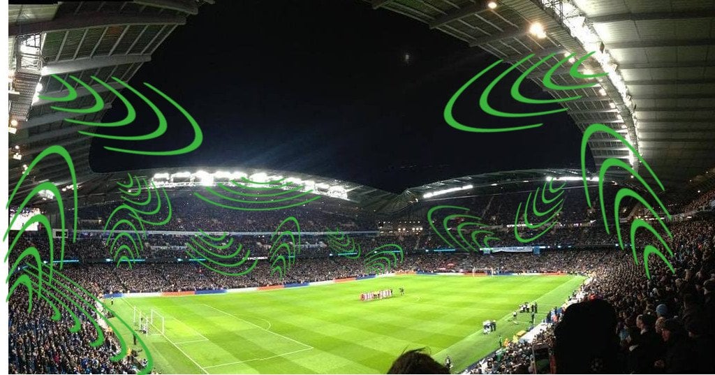 Illustration of stadium crowd noise visualized with green sound waves during a night football match, representing how sound shapes the sporting experience.