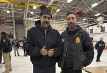 Deals, Disappearances & Fully Charged Skies Venezuelan detainee smiling and giving thumbs up beside law enforcement officers inside an aircraft hangar, raising questions about possible political deal after arrest