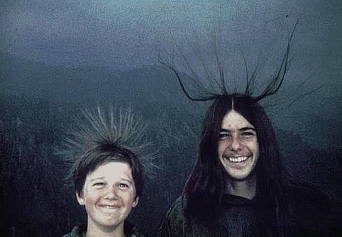 Michael and Sean McQuilken on Moro Rock in 1975 with their hair standing up from electrical charge moments before a lightning strike