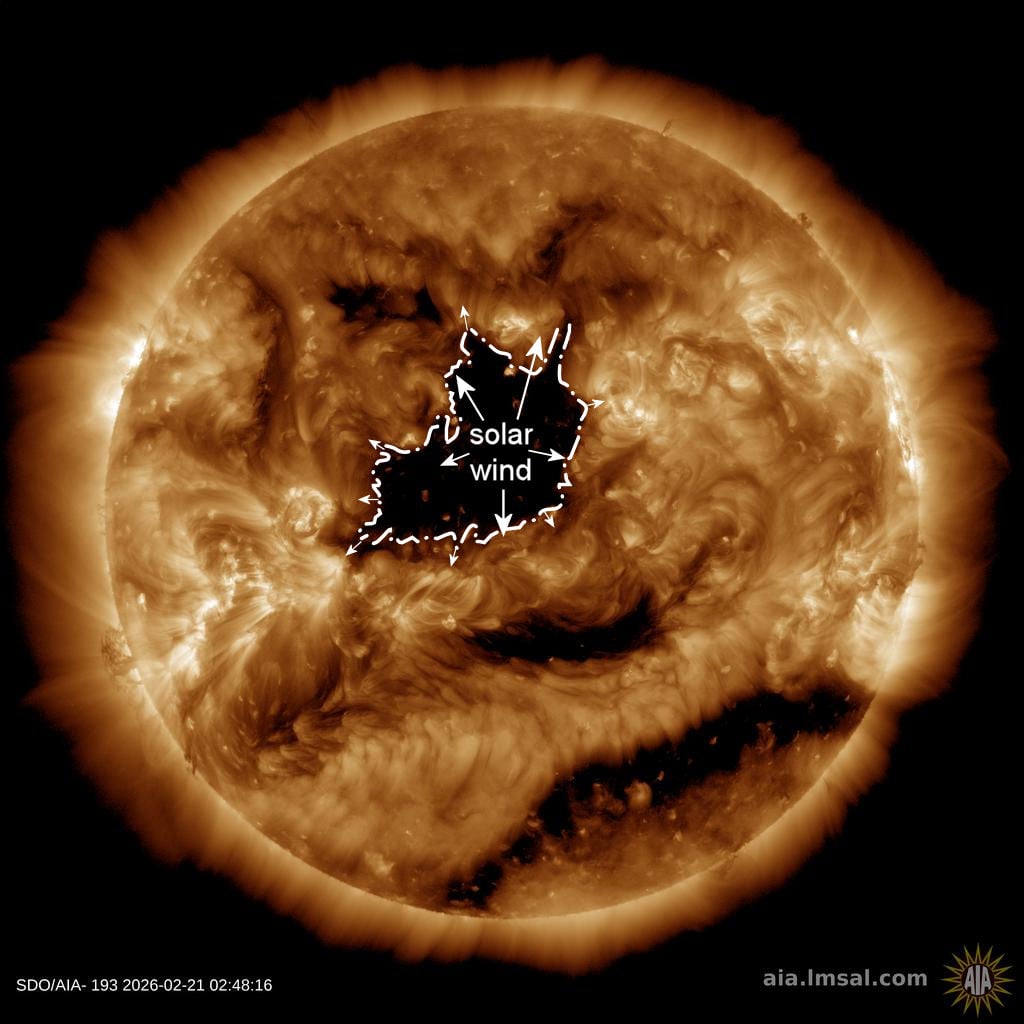SDO AIA 193 image showing a large coronal hole releasing high-speed solar wind toward Earth on February 21, 2026